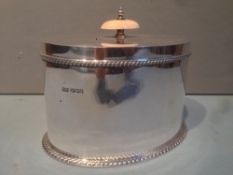 A George III style silver caddy, hallmarked Sheffield 1924, maker's mark of Walker & Hall Limited
Of