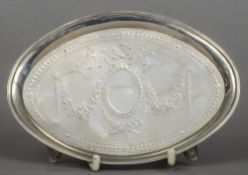 A George III silver teapot stand, hallmarked London 1787, maker's mark of HC
Of oval form with