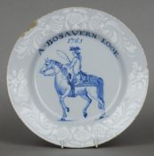 A rare 18th century English Delft plate
The scrolling florally decorated border enclosing a