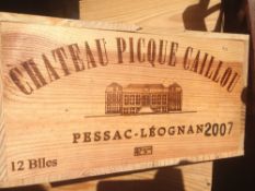 Chateau Picque Caillou Pessac-Leognan 2007
Twelve bottles in old wooden case.  (12)   CONDITION