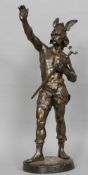 A patinated bronze figure of a Nordic warrior
Modelled wearing a winged helmet holding a sword,