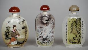 A Chinese inside painted glass snuff bottle
Decorated with landscape vignettes amongst