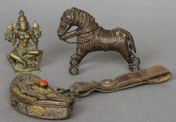 A 19th century Indian bronze model of a four armed deity
An Indian bronze model of a horse; and a