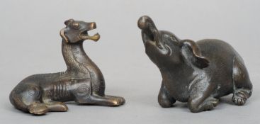 An 18th century Chinese bronze water dropper
Modelled in the form of an elephant; together with a