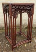 A 19th century Chinese hardwood nest of three tables
The moulded square top above pierced and carved