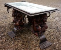 A decorative Bohemian coffee table
The marble inset top above the figural base.  98 cms wide.