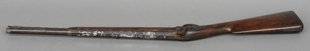 A 19th century percussion cap sporting gun
The silver inset barrel inscribed Bate, London.  99 cms