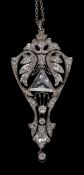 A diamond set platinum Art Deco pendant
Of pierced floral form, centrally set with a large