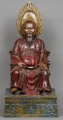 A Chinese pottery figure of Xuan Wu
Modelled seated on his throne, his feet resting on a coiled