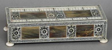 A 19th century Indian horn and ivory penwork decorated cribbage box
Standing on flattened bun feet.