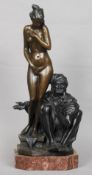 A large bronze figure of a seated Arab offering a nude maiden
Indistinctly signed, standing on a