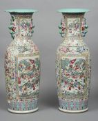 A pair of late 19th/early 20th century Cantonese famille rose vases, of large proportions
Each