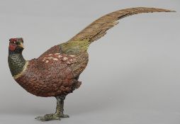 A large cold painted bronze model of a pheasant
Naturalistically modelled and painted.  36 cms long.