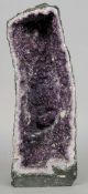 An amethyst geode 
Of typical form.  Approximately 90 cms high.   CONDITION REPORTS:  Overall