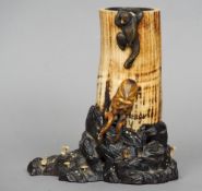 A Japanese Meiji Period ivory tusk pot
Mounted with a carved ivory monkey and an octopus, standing