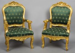 A pair of gilt framed upholstered open armchairs, from the set of James Bond "The World is Not