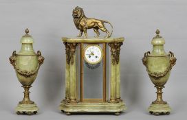 A French bronze mounted and green marble triple clock garniture
Surmounted with the figure of a lion