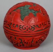 A Chinese cinnabar lacquered box and cover
Of domed circular form with pagodas in a landscape.  11