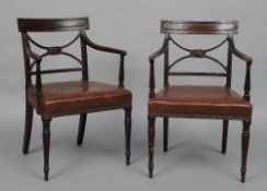 A pair of 19th century mahogany open armchairs
Each panelled bar back above the pierced X-section