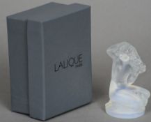 A boxed Lalique  model of a naked female figure
Amongst floral garlands.  8 cms high.   CONDITION