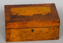 A Victorian parquetry inlaid walnut writing slope
The hinged rectangular lid decorated with a ship