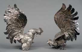 A pair of Italian unmarked silver mounted and silver plated fighting cockerels
Naturalistically
