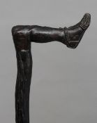 A 19th century carved walking stick
The handle carved as a man's foot and leg.  93 cms long.