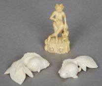 A small 19th century Chinese figural ivory carving 
Depicting a nude female, standing on a tree
