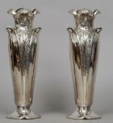 A pair of silver plated Art Nouveau Orfevreie Gallia vases
Each of organic form.  30 cms high.  (2)