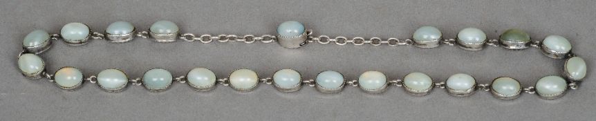 An early 19th century unmarked silver moonstone set necklace 
Each stone of cabochon form.  37 cms