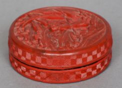 A small late 19th/early 20th century Chinese cinnabar lacquered box and cover
Of circular form,