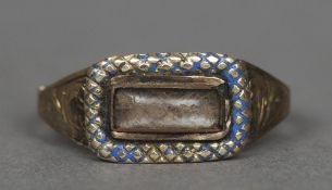 A 19th century unmarked gold mourning ring
Centred with a lock of hair with a crosshatched border
