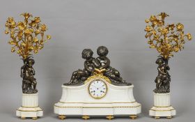 A French bronze and ormolu mounted white marble triple clock garniture
Surmounted with a pair of