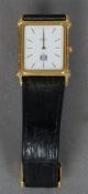 An 18 ct gold Ebel wristwatch
The white dial with batons, bordered by twin rows of small