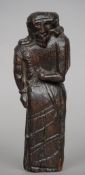 An early carved oak figure
Possibly formed as a man of religion.  20 cms high.   CONDITION REPORTS: