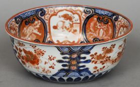 A late 19th century Japanese kutani bowl
Decorated with vignettes of figures and mythical beasts,