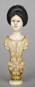 A 19th century Japanese carved ivory figural seal formed as the bust of a woman
An unmarked yellow