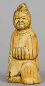 An Oriental carved ivory figure, possibly mammoth ivory
Formed as a kneeling gentleman.  10.5 cms