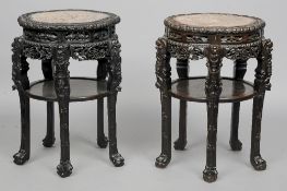 A matched pair of late 19th/early 20th century Chinese marble inset carved hardwood side tables
Each