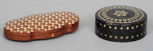An early 19th century tortoiseshell snuff box
Of circular form with applied pique work decoration;