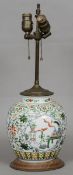 A Chinese porcelain vase, converted to a lamp
Decorated in relief with precious object vignettes