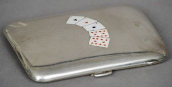 An unmarked silver cigarette case
The domed front inset with five enamel playing cards.  8.5 cms