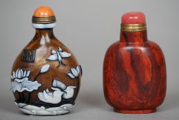 A Chinese carved red stone snuff bottle
With coral type inset cover.  7.5 cms high.   CONDITION
