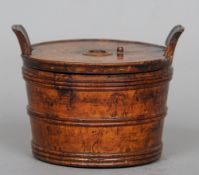 A 19th century Continental treen string box
Of banded barrel form with twin lug handles.  13.5 cms