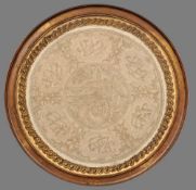 A 19th century Persian silver and gold thread worked roundel
Worked with calligraphic vignettes