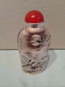 A Chinese inside painted glass snuff bottle
Decorated with ducks and calligraphic script with red
