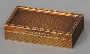 A 9 ct gold snuff box 
With allover engine turned decoration.  4.5 cms wide.   CONDITION REPORTS: