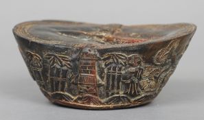 A Chinese horn carving, possibly a paperweight
Decorated with various figures in a landscape.  13