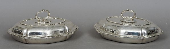 A pair of Victorian silver entree dishes, hallmarked Sheffield 1854, maker's mark of H & H
Each of