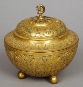 A 19th century gilt metal lidded pot, possibly Turkish
With a pierced finial and engraved